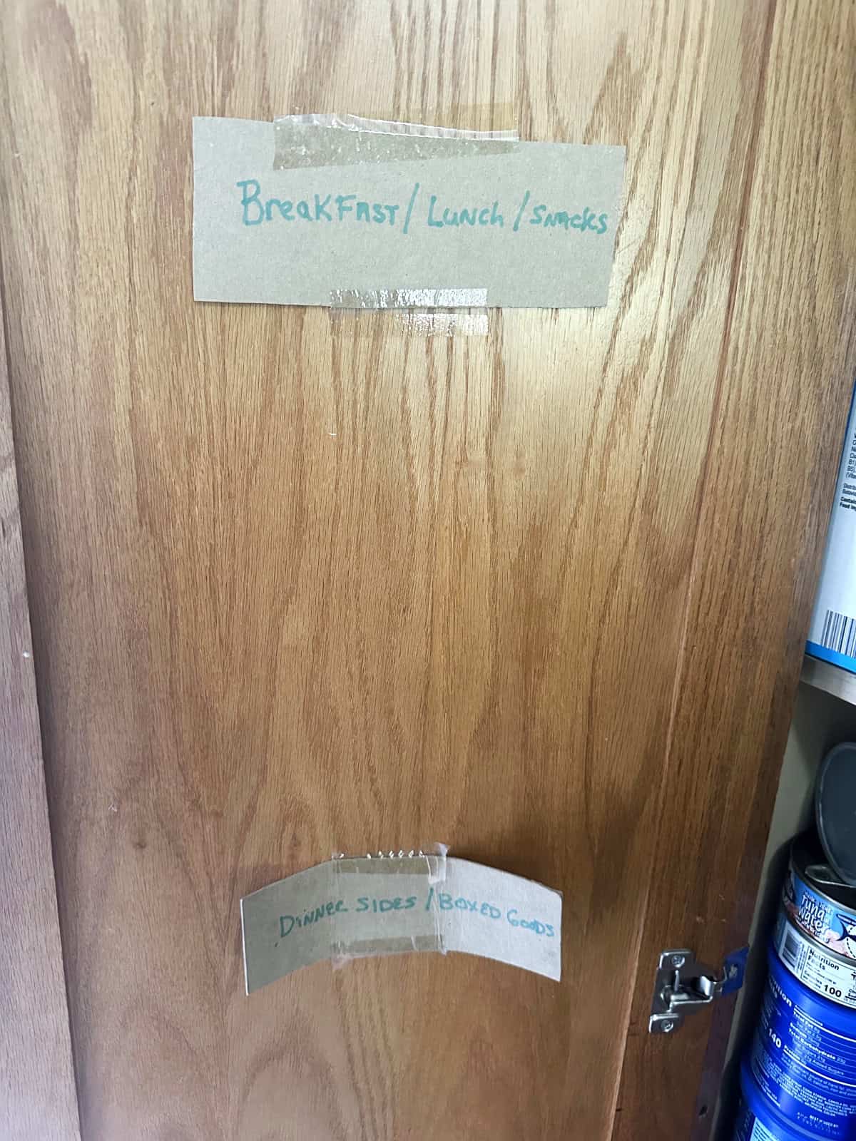 signs on cupboard door for organization