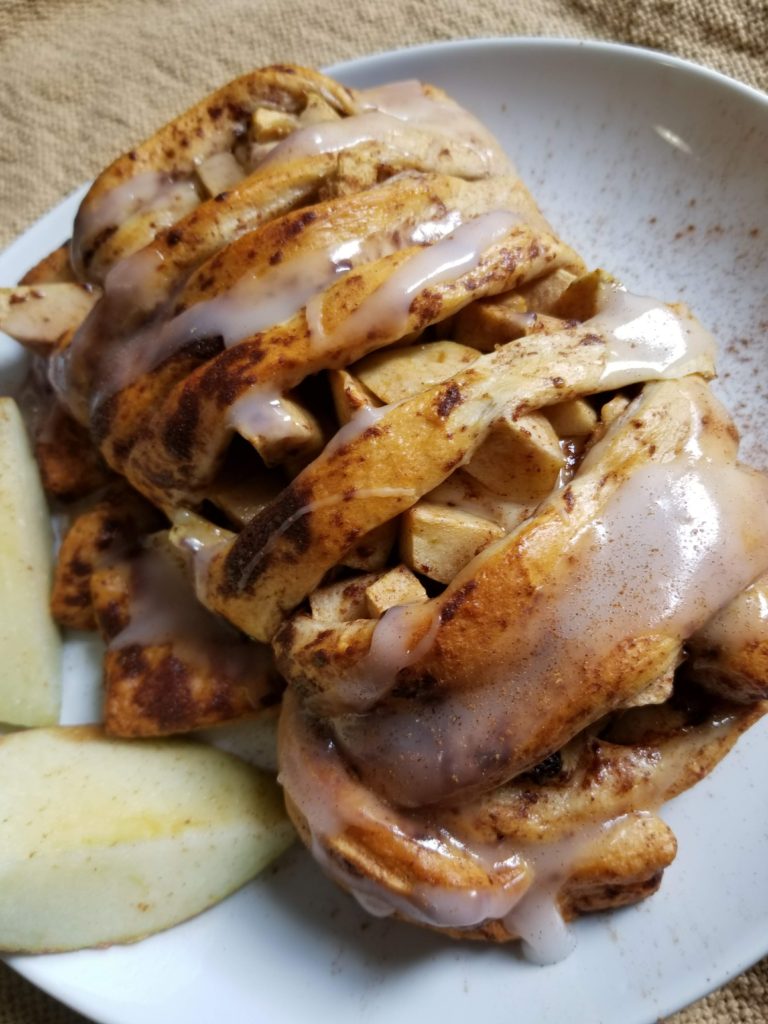 warm apple cinnamon roll up after baked