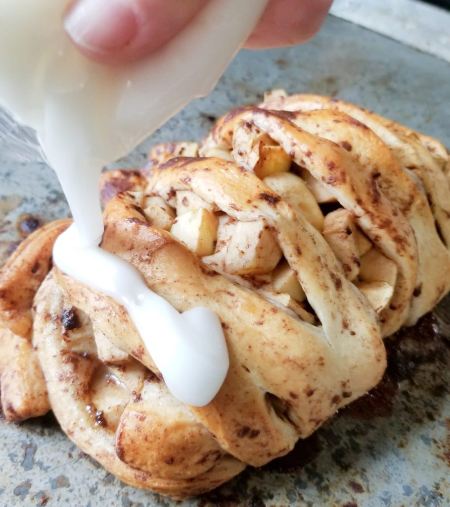 drizzle icing over baked cinnamon roll up