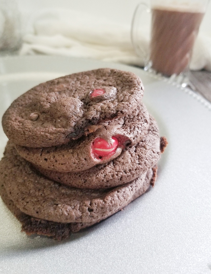 peppermint hot cocoa cake cookies stacked on a plate 