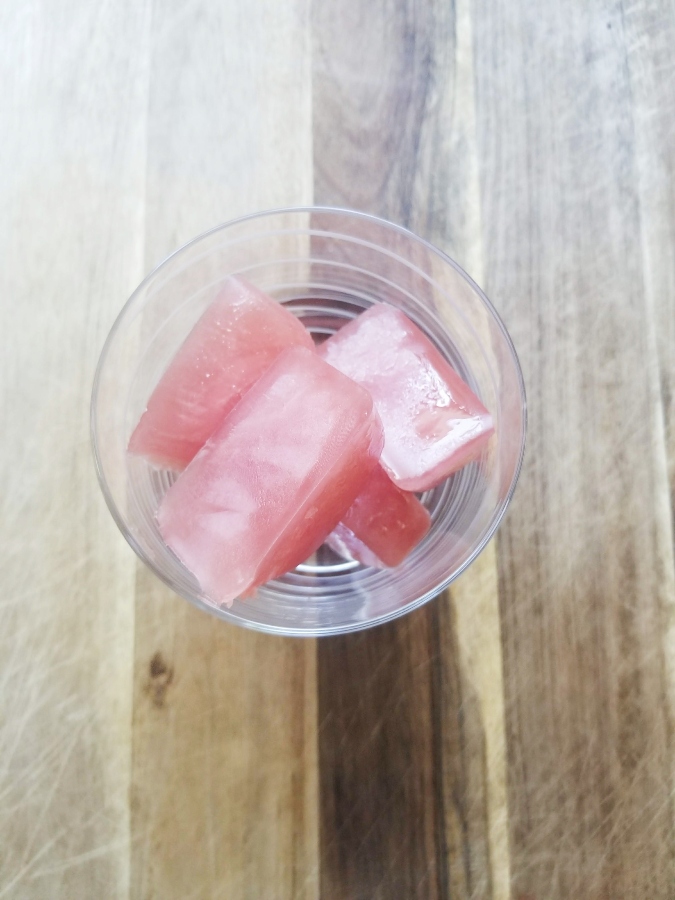 Orange Cranberry Smoked ice cubes in glass 