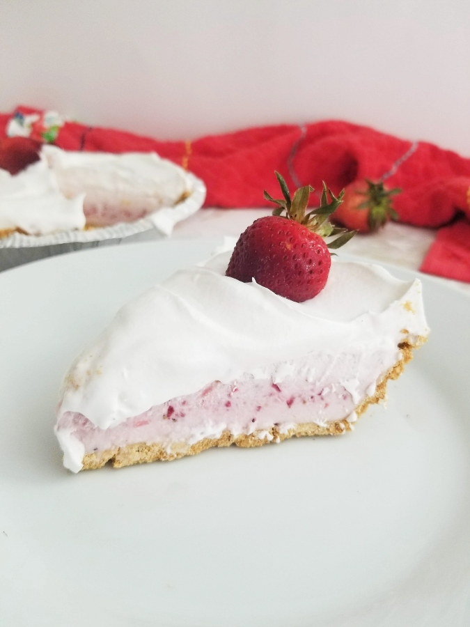 Strawberry Freeze Pie slice on white plate