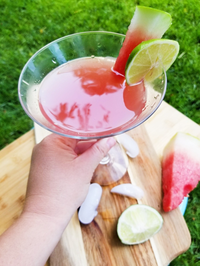 Watermelon Lime Martini with hand cheers!