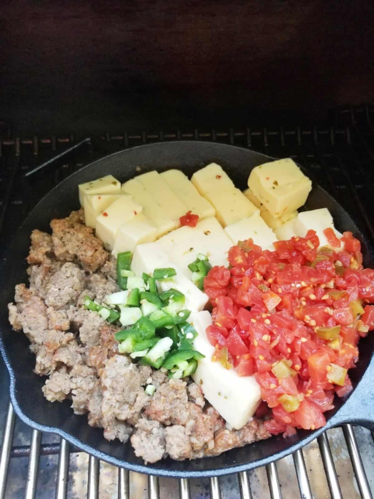 queso in cast iron in smoker
