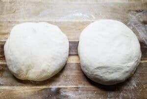 Homemade pizza dough on cutting board