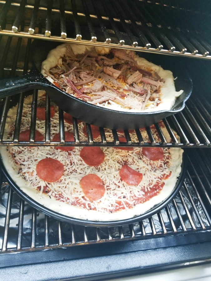 Leftover brisket bbq pizza on the grill