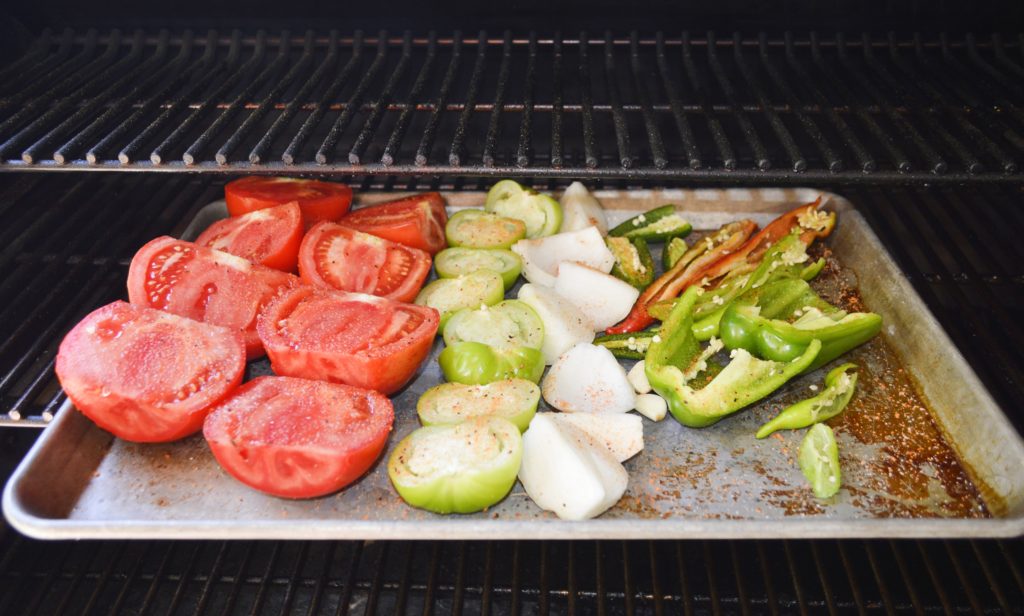 Vegetables on sheet pan in smoker 