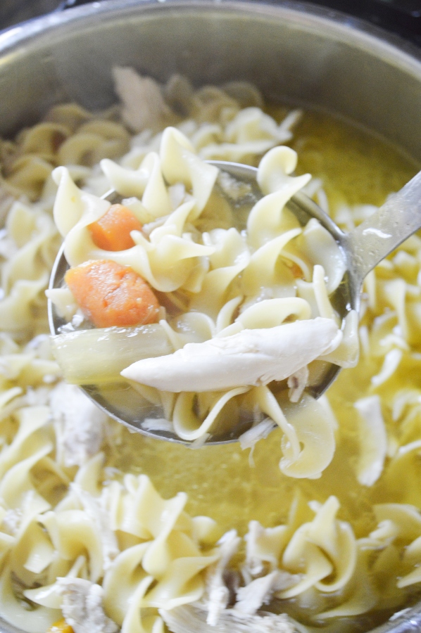 chicken noodle soup on ladle 