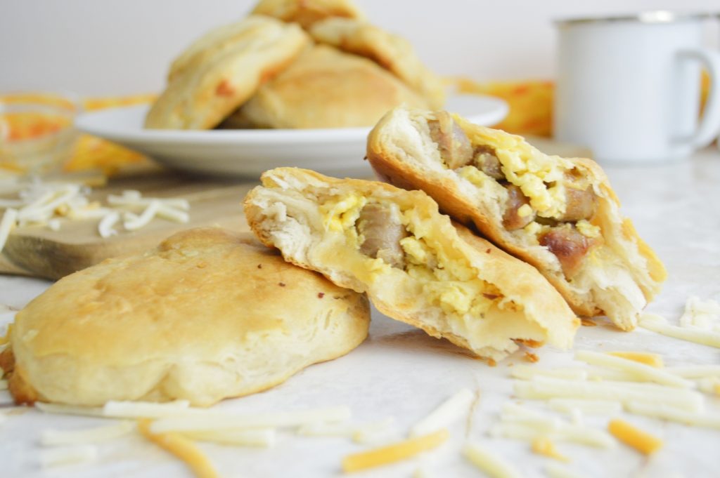 Sausage Egg & Cheese Stuffed Biscuits split open stacked 