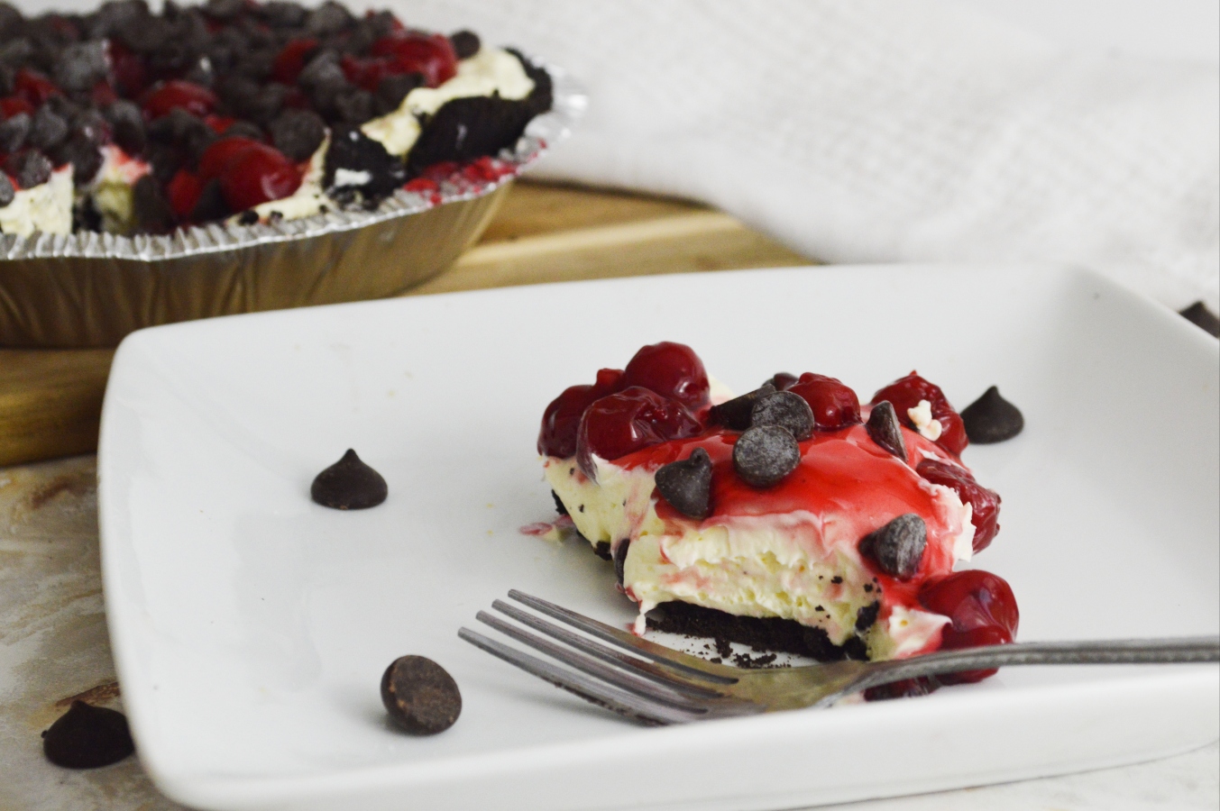 Cherry Chocolate Chip No bake Cheesecake slice with fork 