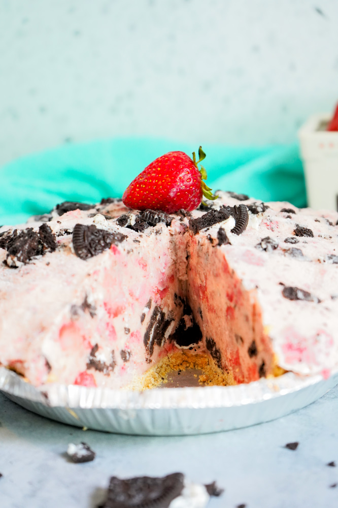 Mile High strawberry cookies n cream pie with slice missing