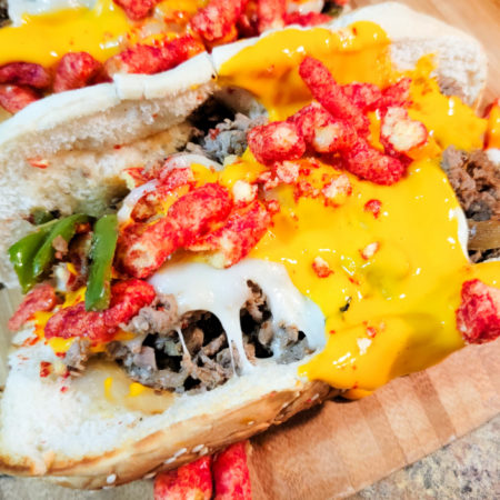 Flamin Hot cheesesteaks on the blackstone
