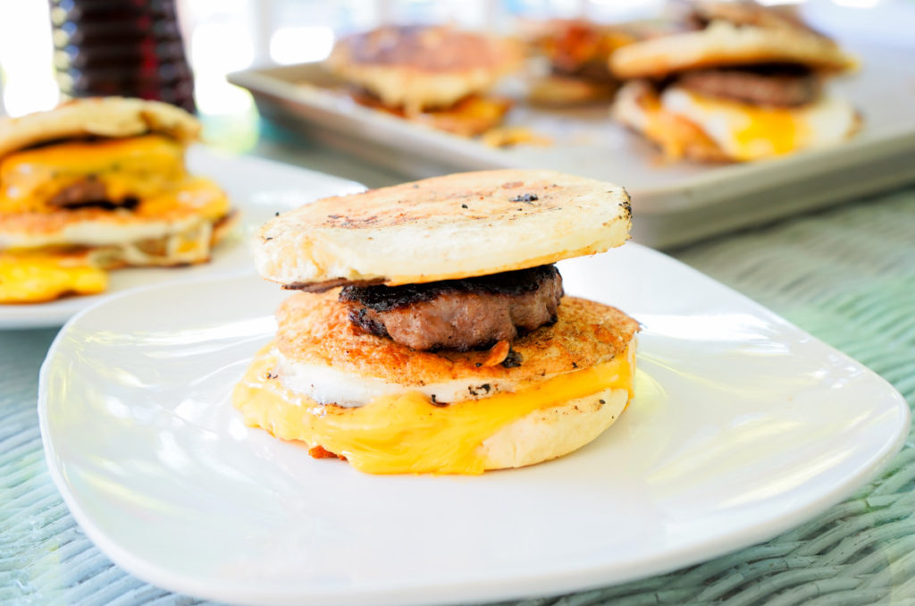 Homemade McGriddles cooked on the Blackstone with sausage, egg, and gooey cheese.