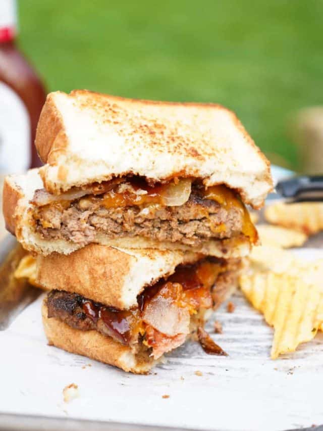 Smash burgers stacked on platter