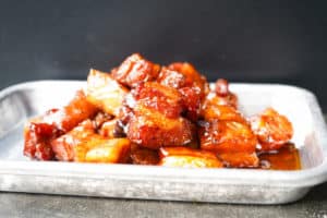 Sriracha whiskey pork belly smoked burnt ends in serving tray