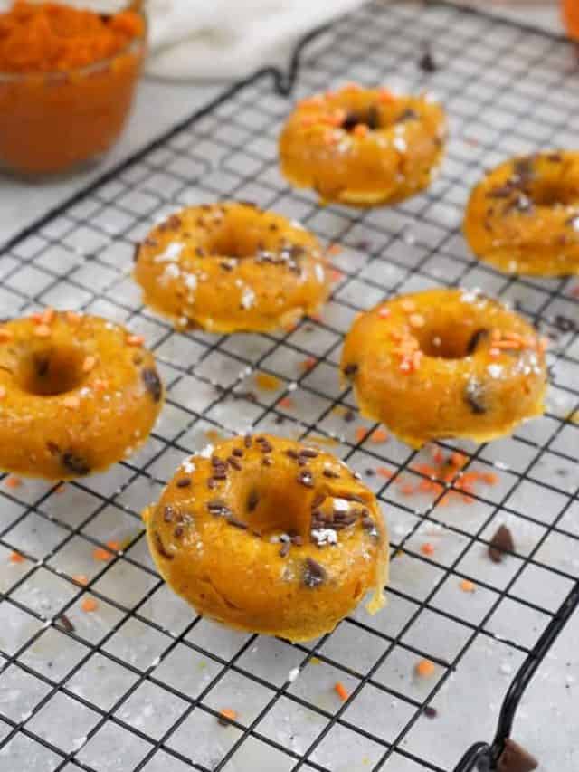pumpkin donuts on cooling rack