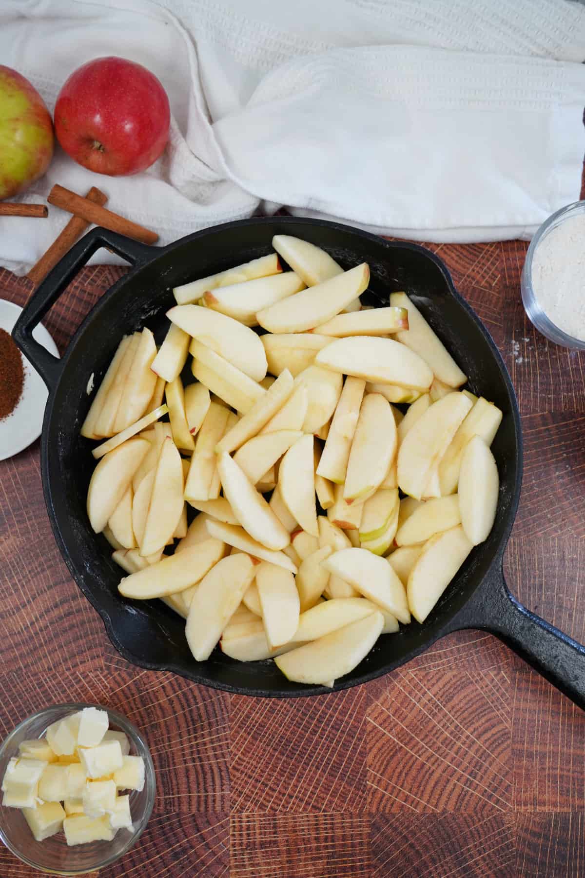 sliced apples in cast iron pan