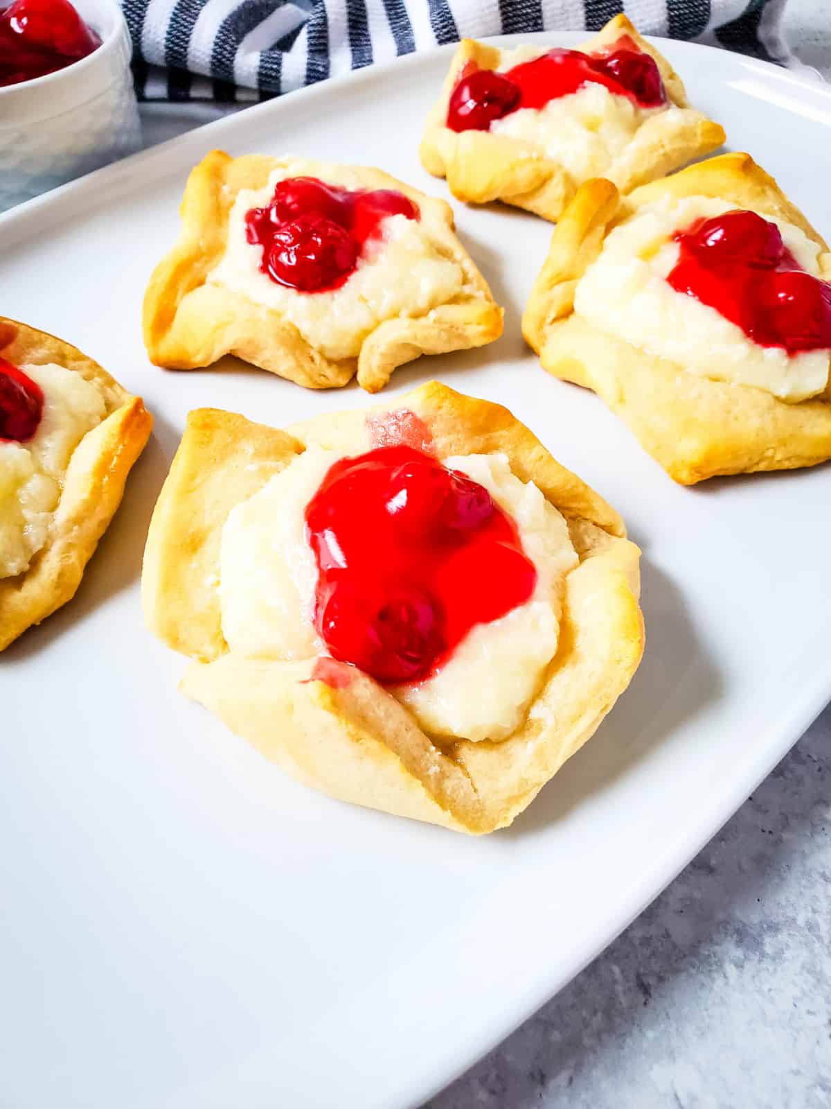 Crescent rolls with cheesecake filling and cherry pie filling. 