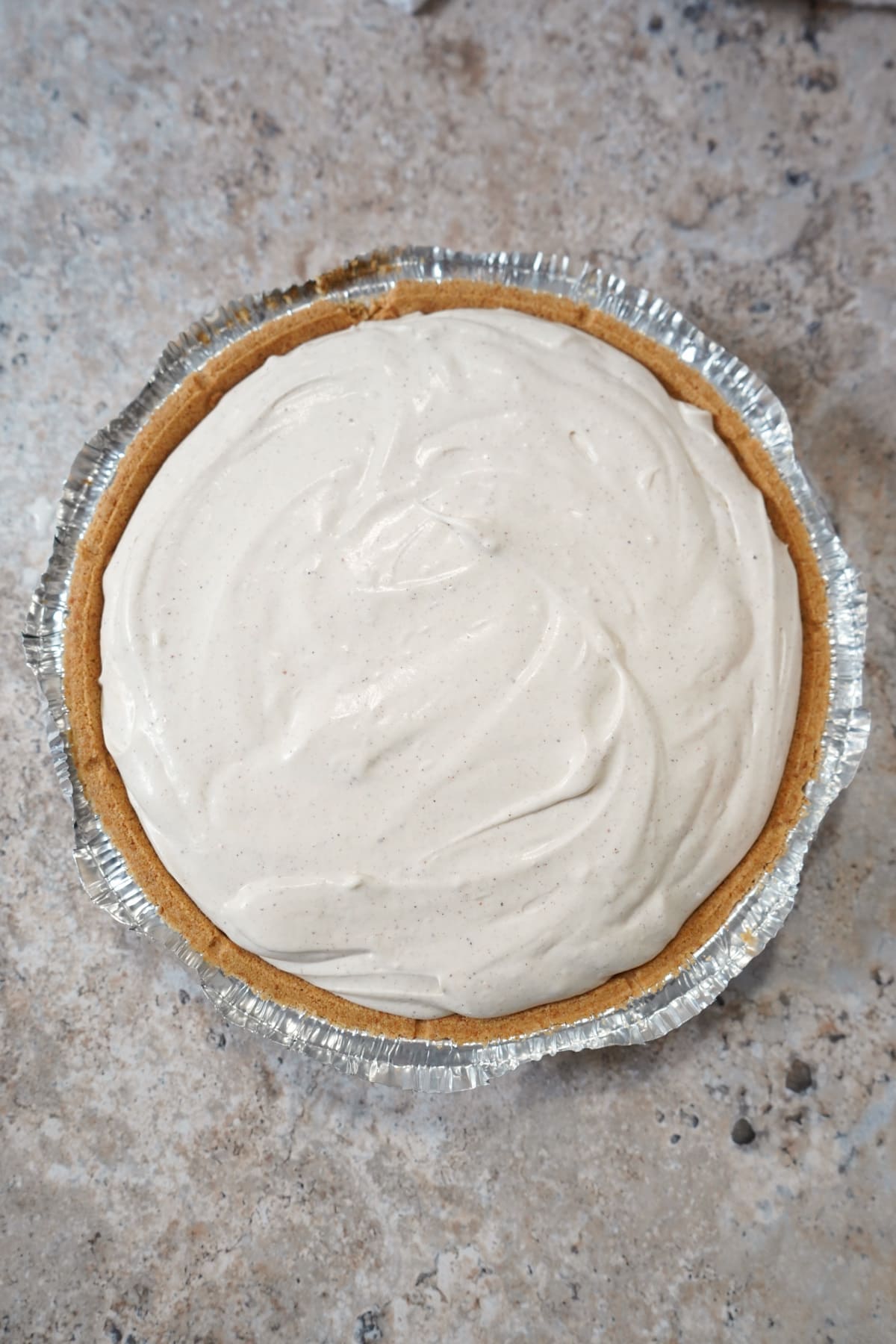 eggnog cheesecake filling in crust. 