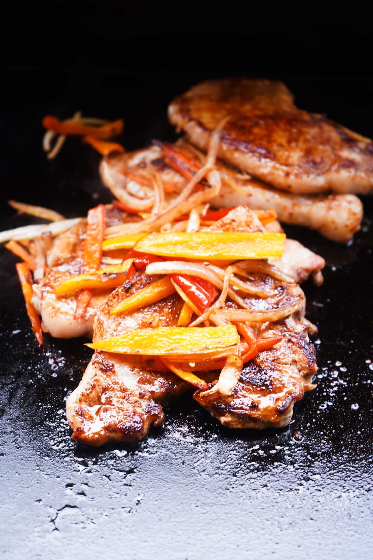 Blackstone Pork Chops with peppers and onions