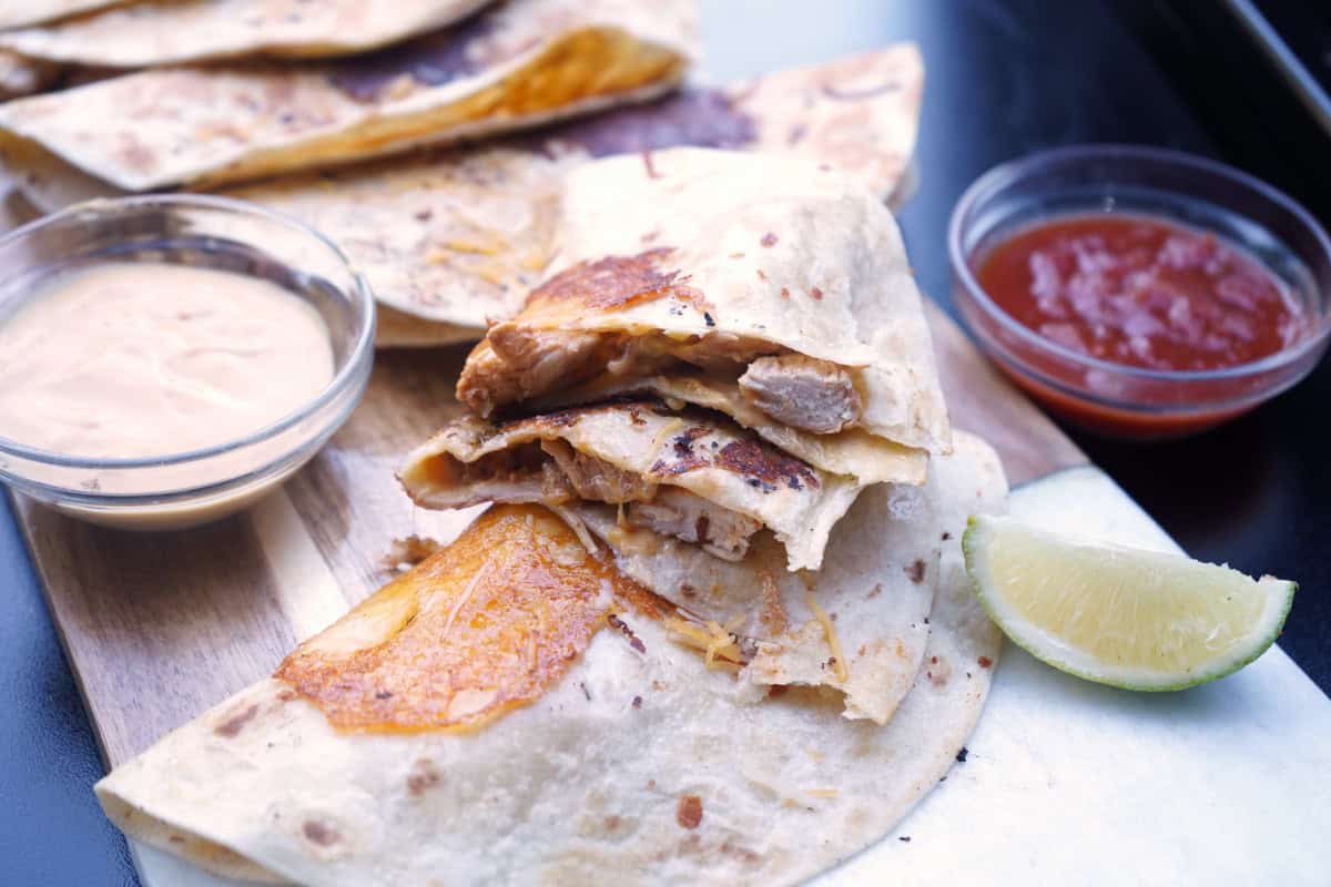 Queso chicken tacos cut in half