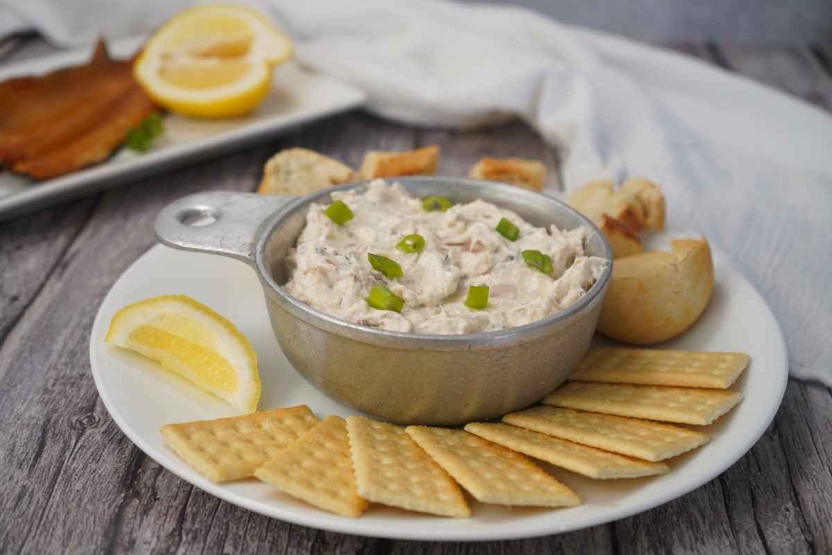 Smoked trout dip on plate with crackers