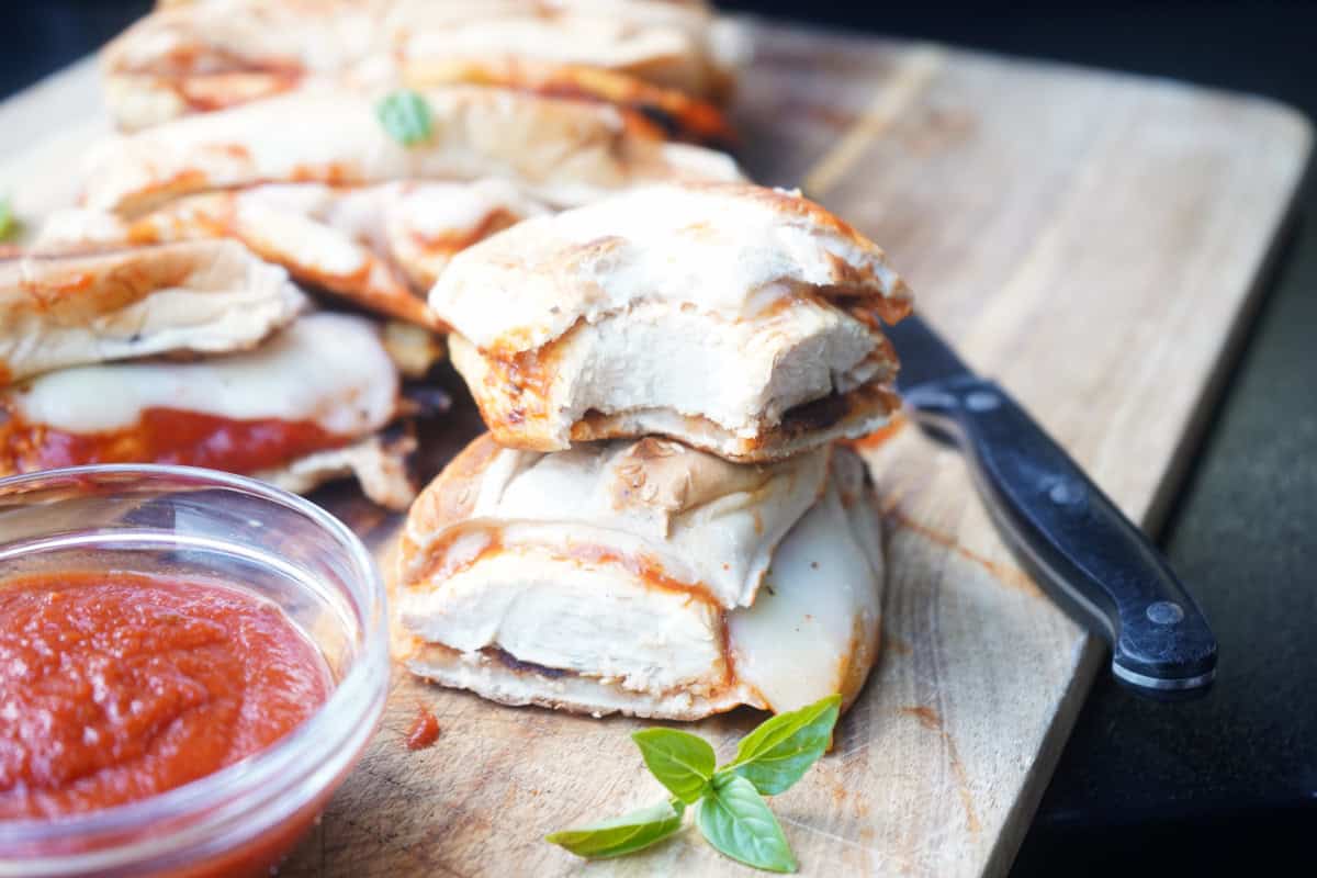 Chicken parmesan sandwich cut in half.