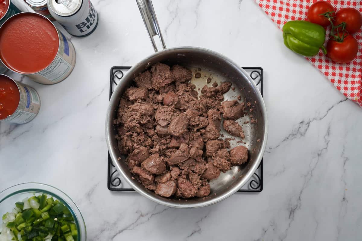 venison and beef cooking in pan 