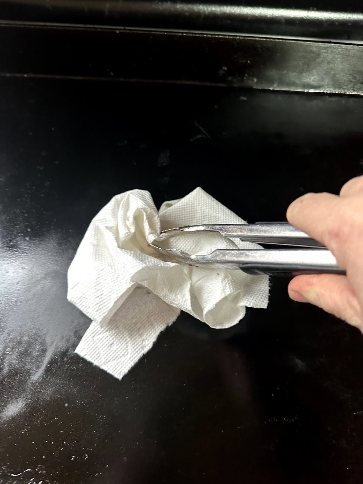 rubbing oil into grill