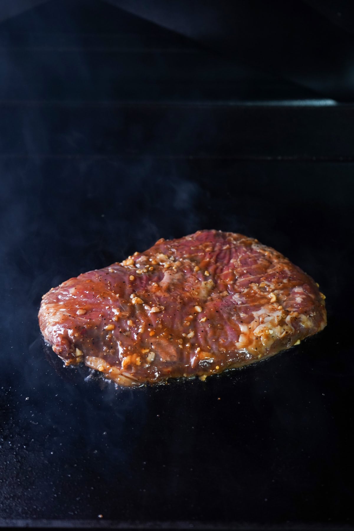 marinated flank steak cooking