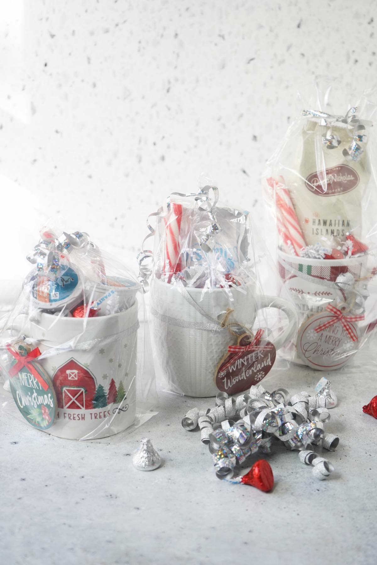 Christmas Coffee Cups all wrapped in loot bags and ribbon 