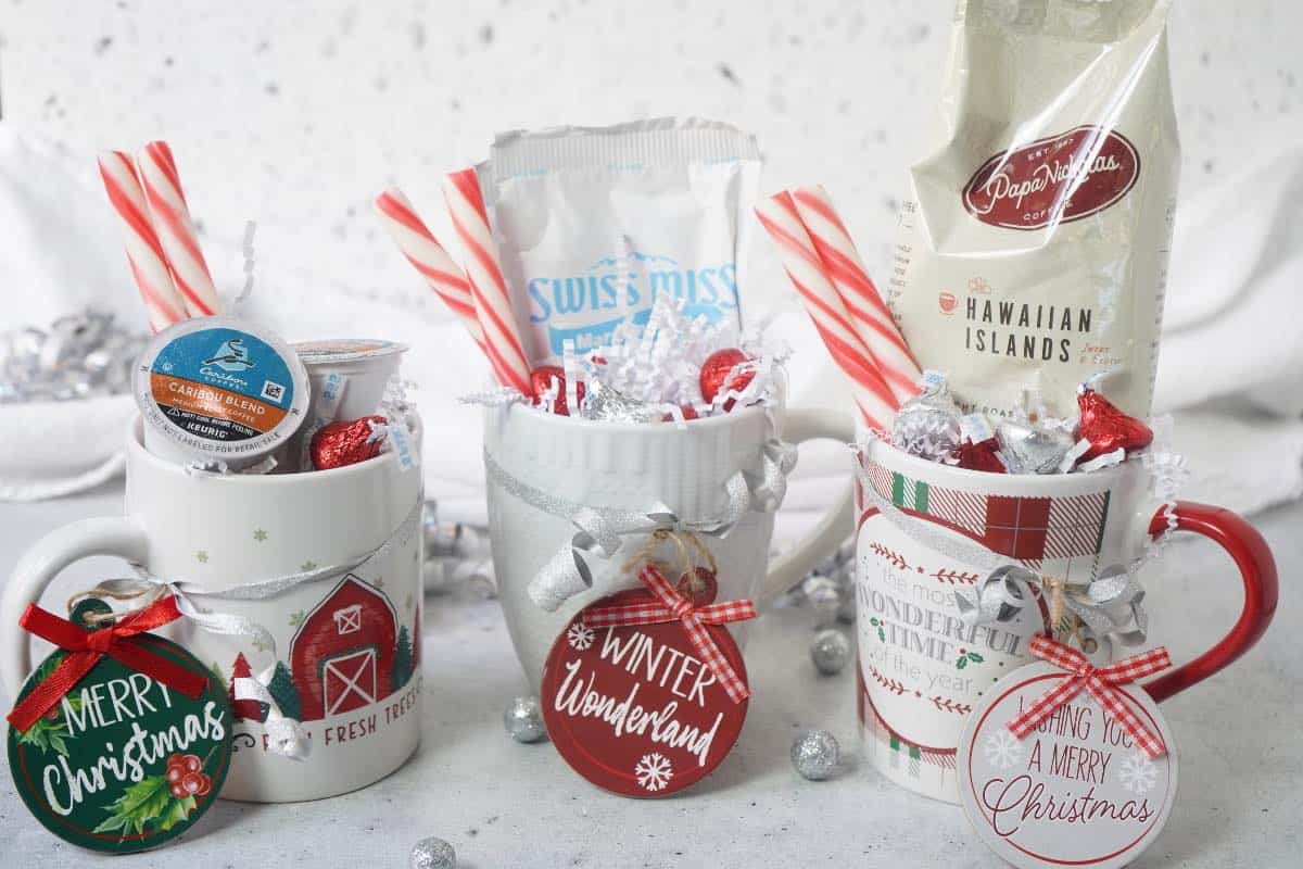 Coffee cups filled with coffee or hot cocoa and tied with an ornament 