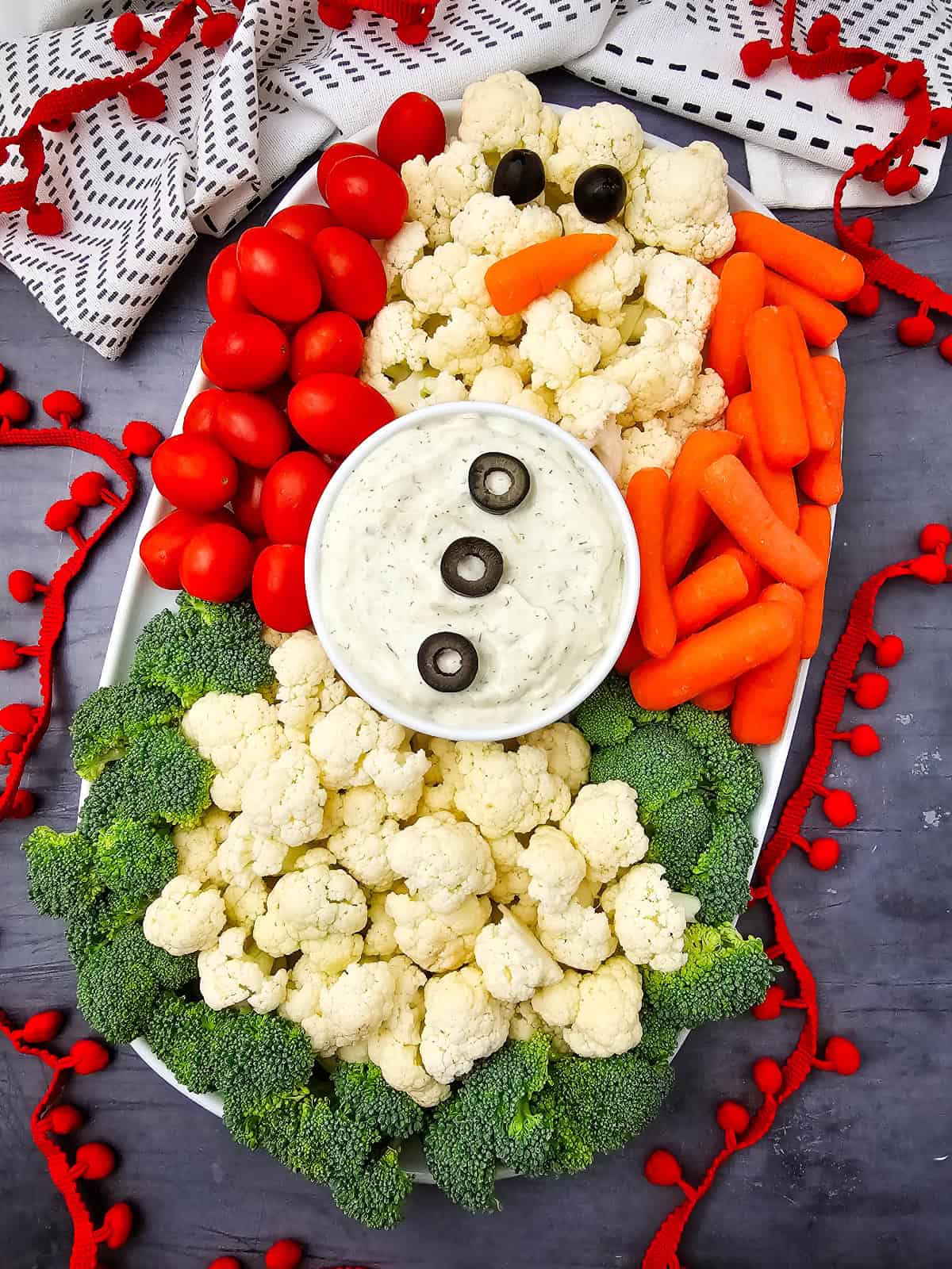 Snowman Veggie Platter with red ribbon