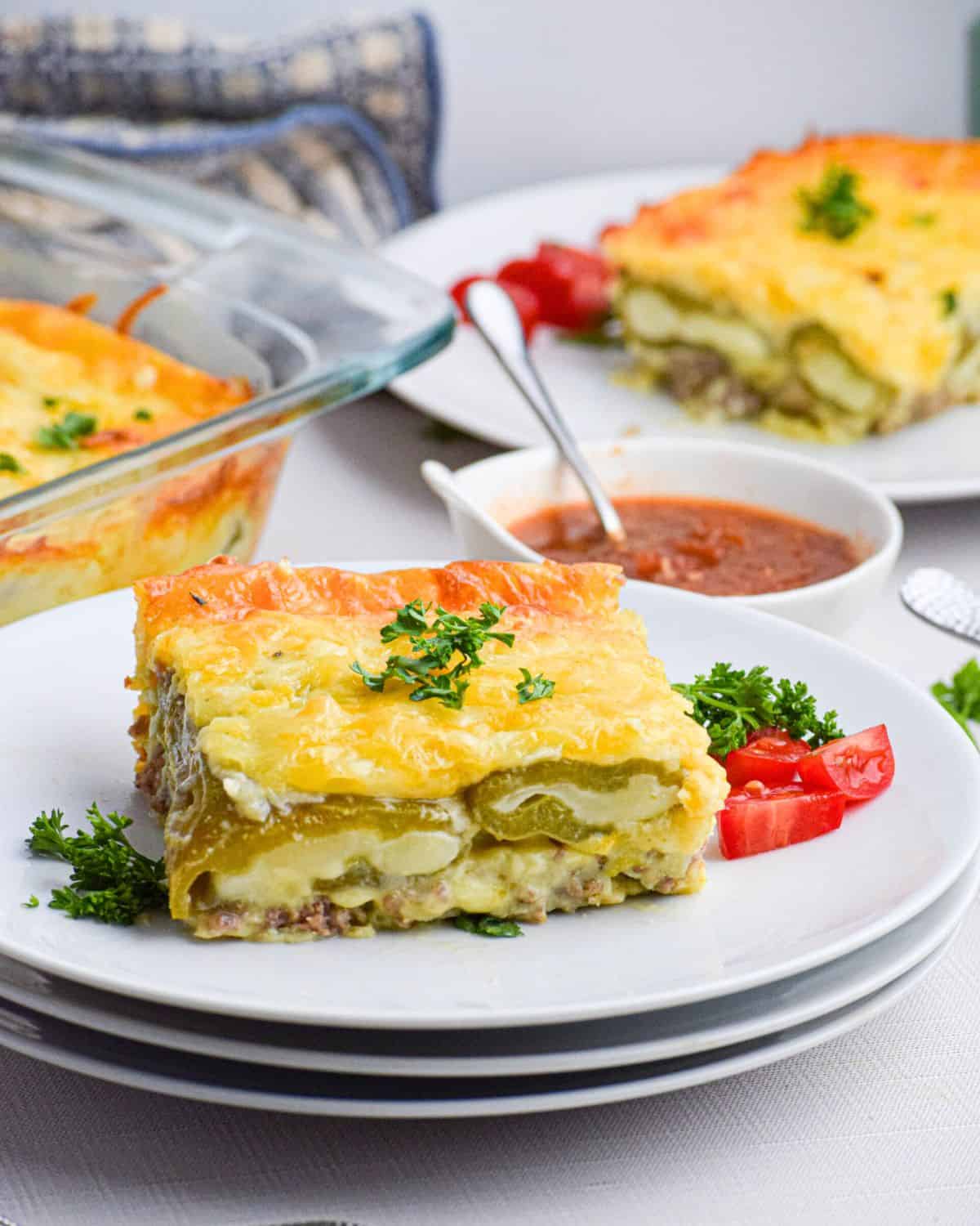 Chile Relleno breakfast bake on white plates