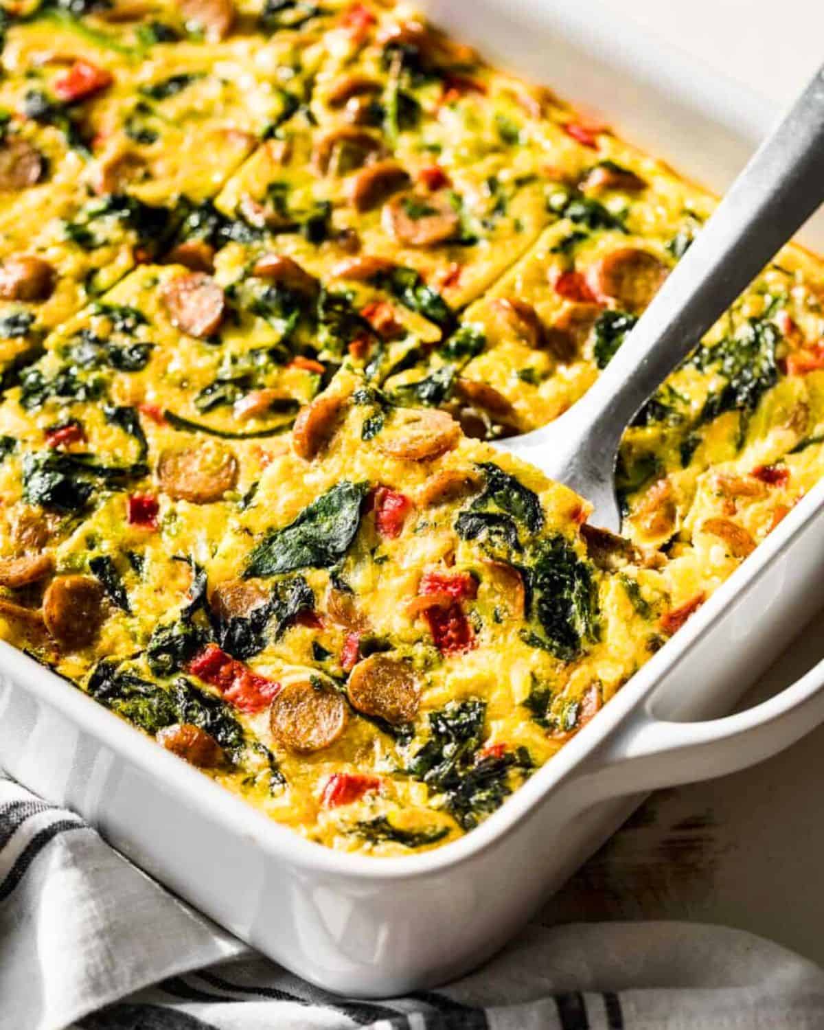 Sausage Hash Brown Breakfast Casserole with spatula