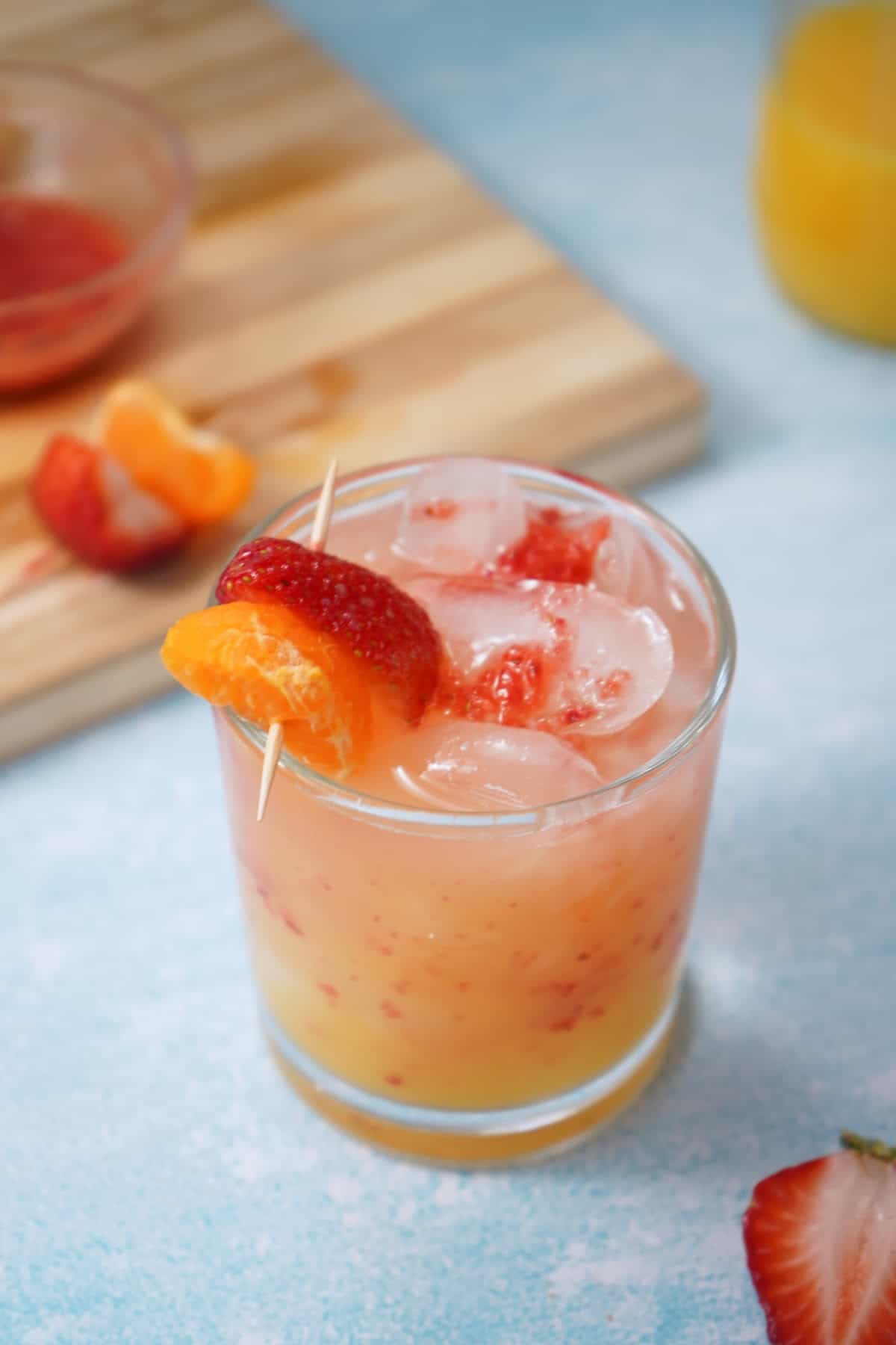 Strawberry Tequila Sunrise with strawberry and orange slice 