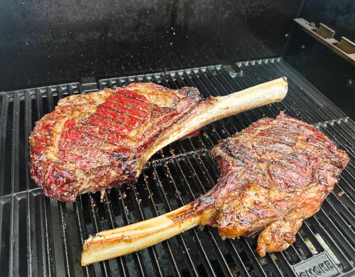 Smoked Tomahawk steaks on grill