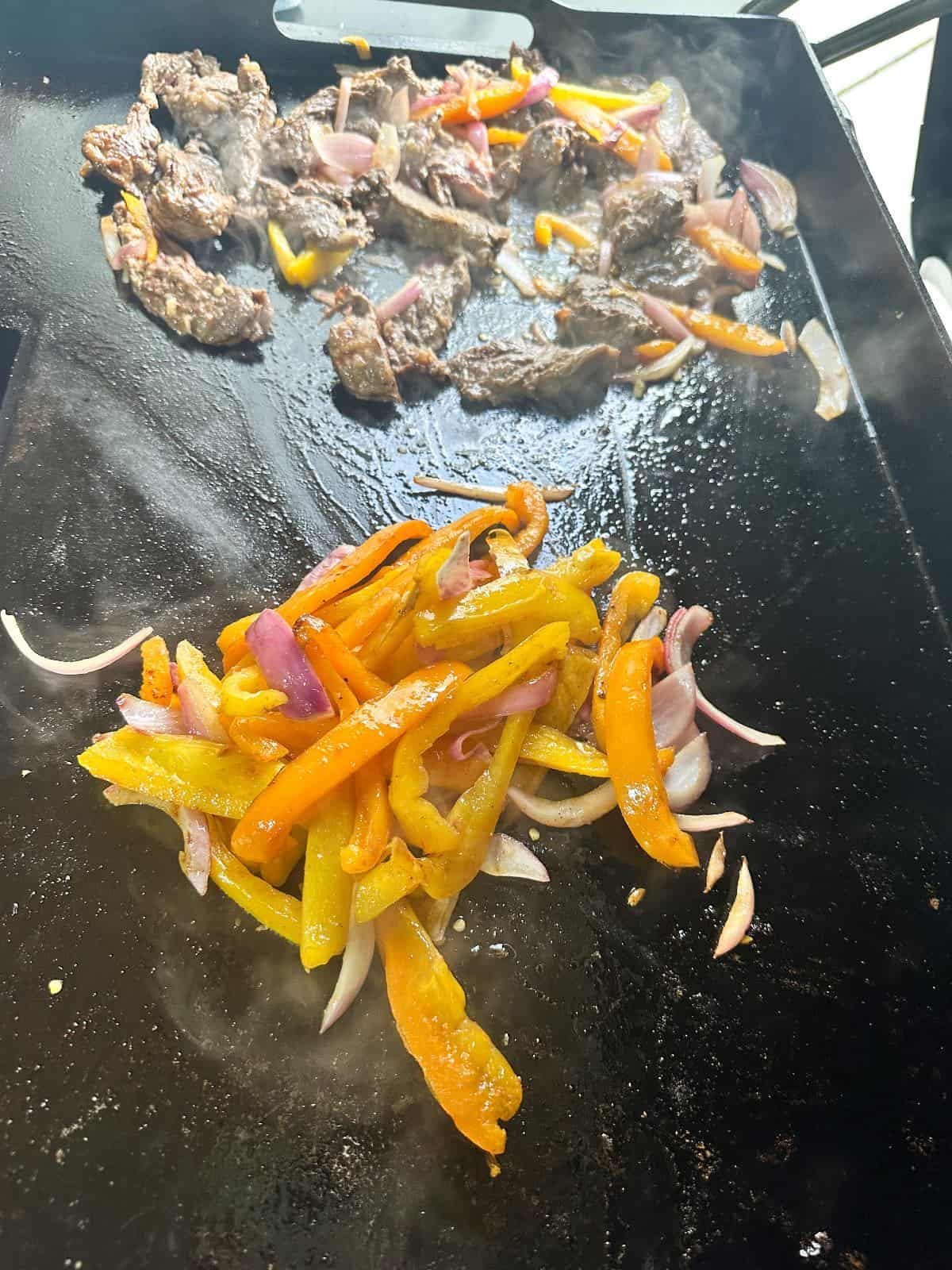 Fajita veggies being cooked