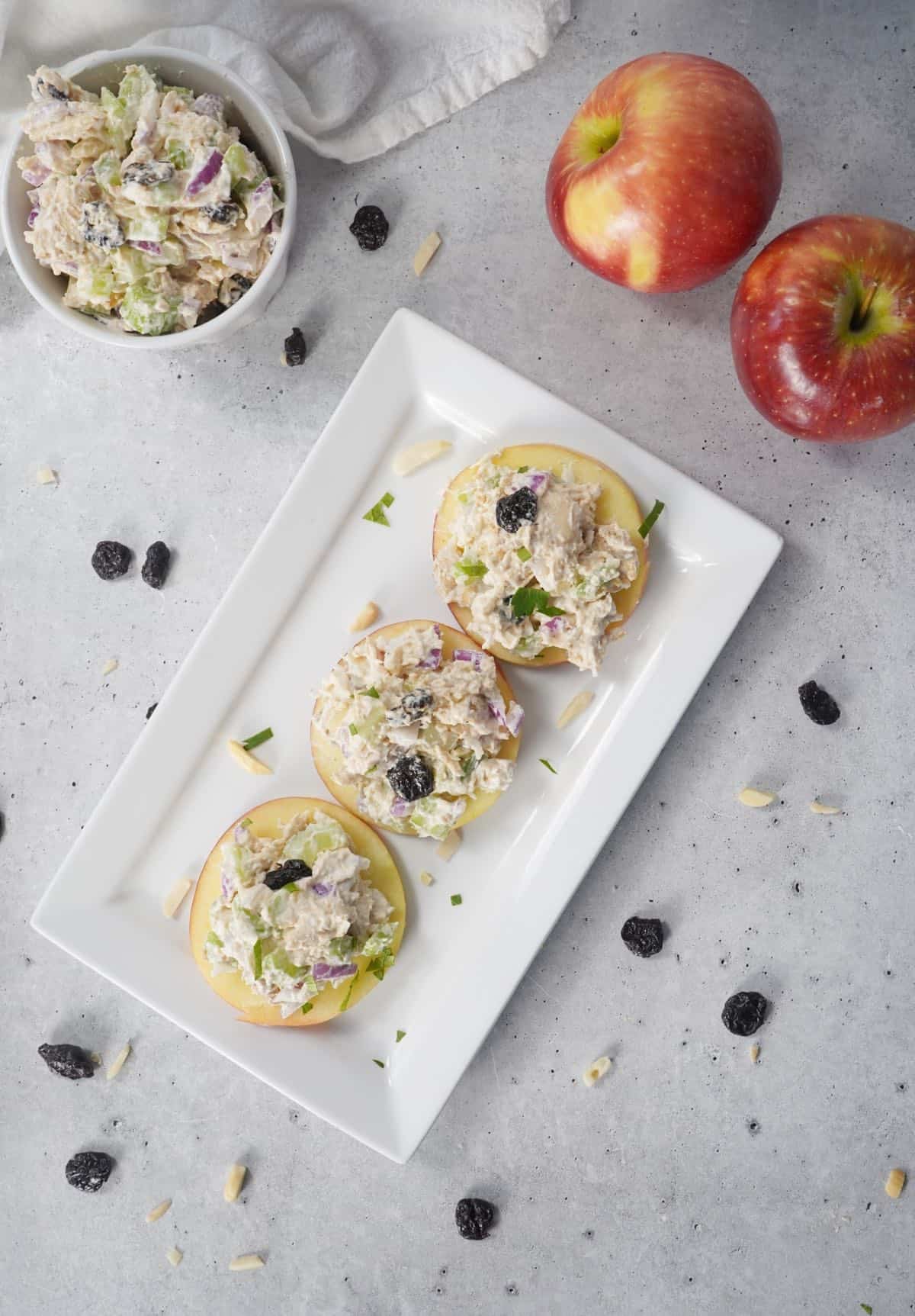 plate of apple slices with chicken salad